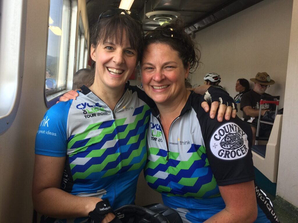 Two cyclists smiling